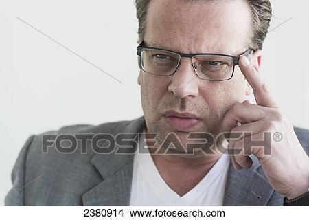 A man in a thinking pose; Locarno, Ticino, Switzerland View Large Photo Image Picture - A man in a thinking pose; Locarno, Ticino, Switzerland. Fotosearch