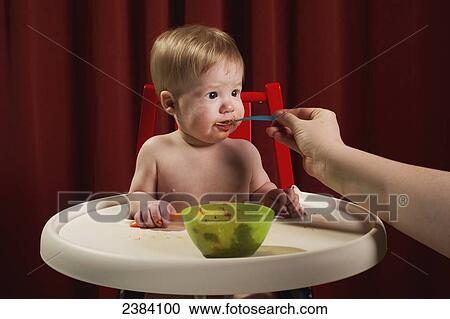 A mother feeds her baby boy; Alberta, Canada View Large Photo Image Stock Image - A mother feeds her baby boy; Alberta, Canada. Fotosearch