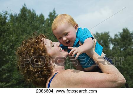 A mother plays with her young son; Stony Plain, Alberta, Canada View Large Photo Image Picture - A mother plays with her young son; Stony Plain, Alberta, Canada. Fotosearch