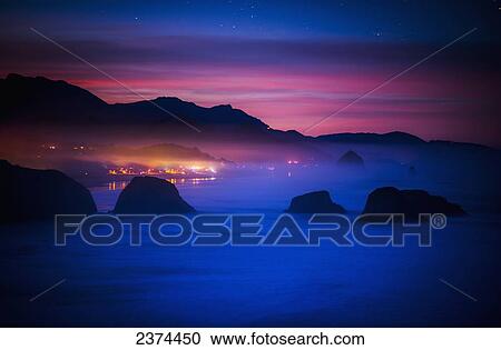 Stock Image - A new day begins on the west coast; Cannon Beach, Oregon, United States of America. Fotosearch