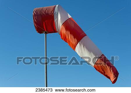 A windsock against a blue sky; Locarno, Ticino, Switzerland View Large Photo Image Stock Image - A windsock against a blue sky; Locarno, Ticino, Switzerland. Fotosearch