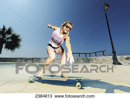 A woman skateboarding; Tarifa, Cadiz, Andalusia, Spain View Large Photo Image Stock Image - A woman skateboarding; Tarifa, Cadiz, Andalusia, Spain. Fotosearch