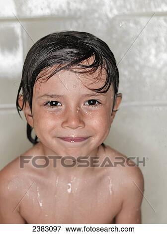 Stock Photo - A young boy wet from a bath; Montreal, Quebec, Canada. Fotosearch