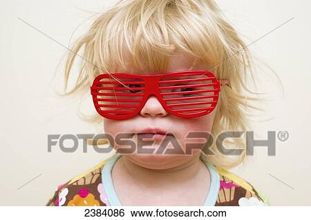 A young girl with funny red eyeglasses; Alberta, Canada View Large Photo Image Stock Photograph - A young girl with funny red eyeglasses; Alberta, Canada. Fotosearch