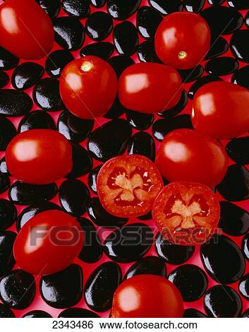 Agriculture - Processing tomatoes on black rocks and red surface, sliced, studio. View Large Photo Image Stock Photograph - Agriculture - Processing tomatoes on black rocks and red surface, sliced, studio.. Fotosearch
