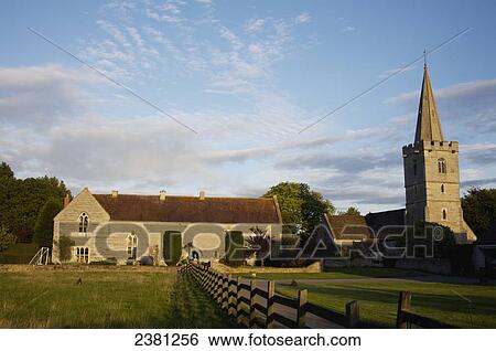 Stock Photograph - Ashleworth court and church near River Severn; Gloucestershire, England. Fotosearch