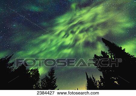 Stock Photo - Aurora Borealis and milky way visible in the sky, Mont-Tremblant National Park; Lanaudiere region, Quebec, Canada. Fotosearch