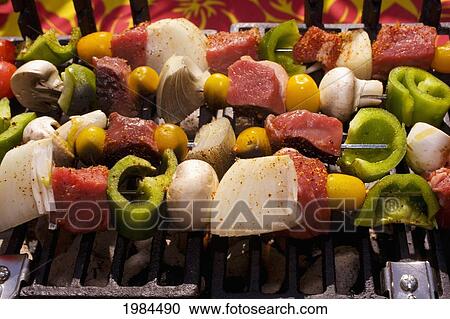 Stock Image - Barbecue Scene, Shish Kabob On The Grill.. Fotosearch