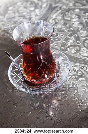 Beverage in a glass cup with a saucer and spoon; Istanbul, Turkey View Large Photo Image Picture - Beverage in a glass cup with a saucer and spoon; Istanbul, Turkey. Fotosearch