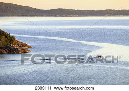 Stock Image - Boat at Pointe Sud, Grande Basque Island, Sept-Iles, Cote-Nord, Duplessis region; Quebec, Canada. Fotosearch