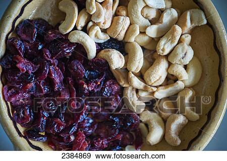 Stock Photo - Bowl of nuts and dried fruit; Silver Spring, Maryland, United States of America. Fotosearch
