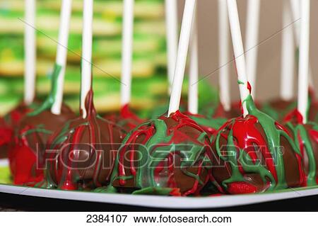 Cake pops decorated with red and green icing for Christmas; Alberta, Canada View Large Photo Image Stock Photo - Cake pops decorated with red and green icing for Christmas; Alberta, Canada. Fotosearch