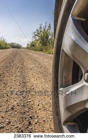 Stock Photograph - Close up of a tire on a dirt road; Fort McKay, Alberta, Canada. Fotosearch