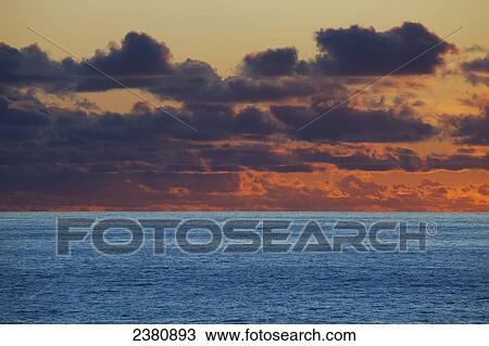 Stock Image - Clouds at sunset over the pacific ocean; Washington, United States of America. Fotosearch