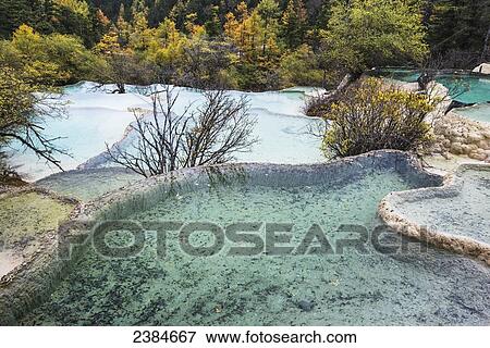 Stock Photo - Colourful pools formed by calcite deposits; Huanglong, Sichuan province, China. Fotosearch
