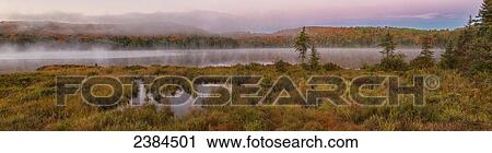 Dawn over the misty water of Brewer Lake in Algonquin Park in autumn; Ontario, Canada View Large Photo Image Stock Image - Dawn over the misty water of Brewer Lake in Algonquin Park in autumn; Ontario, Canada. Fotosearch