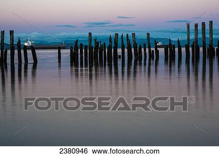 Stock Photograph - Dusk settles over the Columbia River; Astoria, Oregon, United States of America. Fotosearch