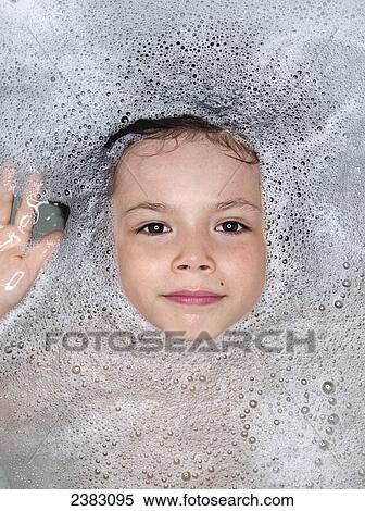 Face of a young boy surrounded by bubbles in the bathtub; Montreal, Quebec, Canada View Large Photo Image Stock Photography - Face of a young boy surrounded by bubbles in the bathtub; Montreal, Quebec, Canada. Fotosearch