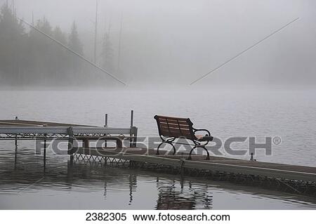 Stock Photography - Foggy morning at the lake; Waterloo, Quebec, Canada. Fotosearch