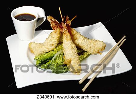 Stock Image - Food - Tempura Prawns and Ponzu Dip. Ingredients include prawns, tempura batter, lime juice, brown sugar, Asian fish sauce, soy sauce, red chilies and cilantro.. Fotosearch