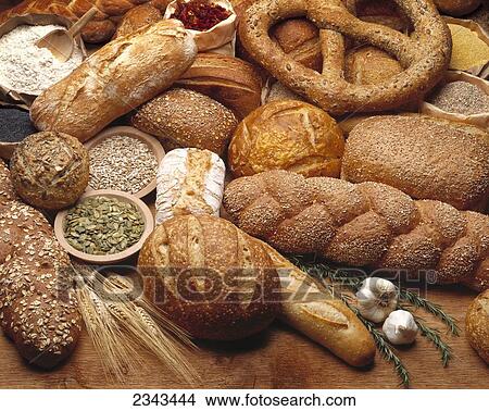 Food - Various types of breads and some of their ingredients. View Large Photo Image Picture - Food - Various types of breads and some of their ingredients.. Fotosearch
