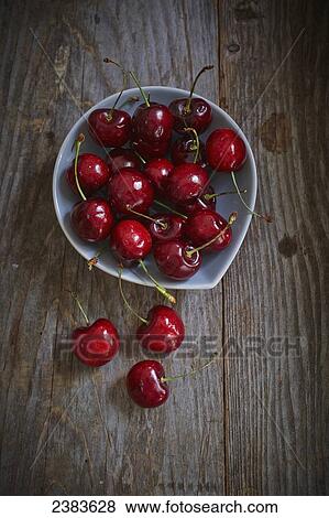 Fresh picked cherries in a bowl View Large Photo Image Stock Photo - Fresh picked cherries in a bowl. Fotosearch