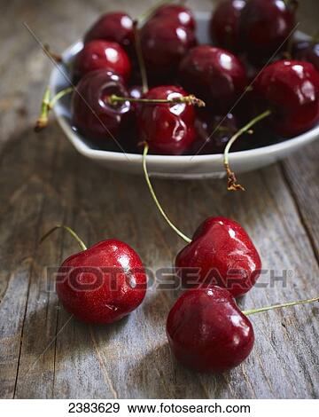 Stock Photo - Fresh picked cherries in a bowl. Fotosearch