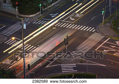 Stock Photo - High angle view of an intersection with painted arrows and crosswalks; Honolulu, Oahu, Hawaii, United States of America. Fotosearch