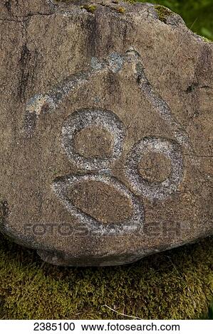 Stock Image - Historical petroglyphs at a protecteds archaeological site sign, Wrangell, Southeast Alaska. Fotosearch