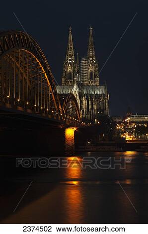 Hohenzollern Bridge over the River Rhine and Cologne Cathedral; Cologne, Germany View Large Photo Image Stock Image - Hohenzollern Bridge over the River Rhine and Cologne Cathedral; Cologne, Germany. Fotosearch