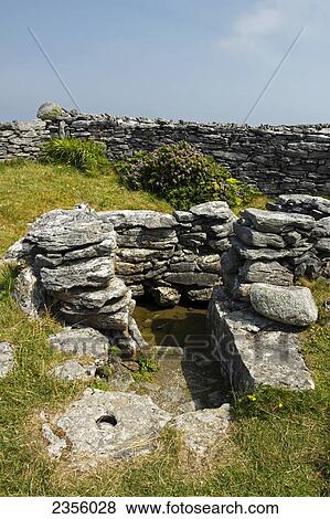 Stock Photo - Holy well of St. Enda on Inisheer island off the Galway coast; County Galway, Ireland. Fotosearch