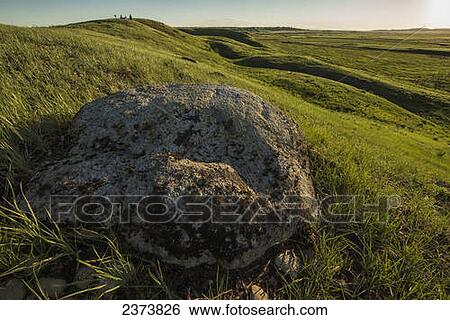 Stock Photograph - Large rock left behind in Grasslands National Park; Saskatchewan, Canada. Fotosearch