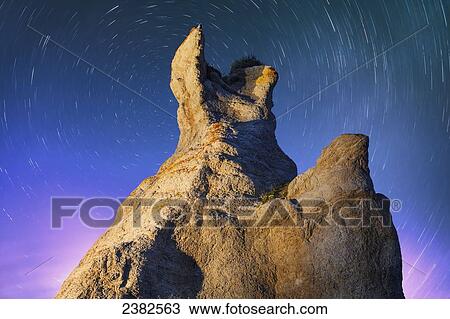 Stock Image - Light painting on La Montagnaise and star trails, Ile Nue de Mingan, Mingan Archipelago National Park Reserve of Canada, Cote-Nord, Duplessis region; Quebec, Canada. Fotosearch