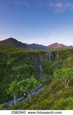 Looking up river to the Eas Mor waterfall and the hills of the Black Cuillin at dusk; Isle of Skye, Scotland View Large Photo Image Stock Image - Looking up river to the Eas Mor waterfall and the hills of the Black Cuillin at dusk; Isle of Skye, Scotland. Fotosearch