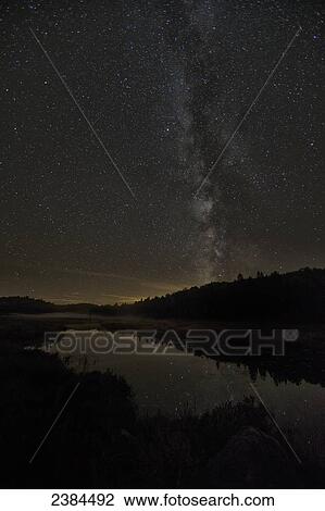 Stock Image - Milky way over Costello Creek, Algonquin Park; Ontario, Canada. Fotosearch