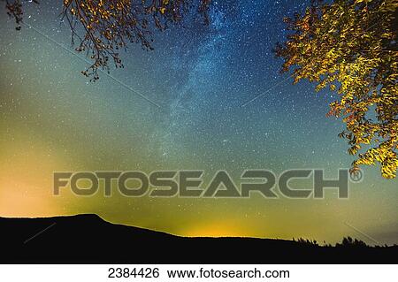 Stock Photograph - Milky way visible in the sky over Mount Pinnacle; Frelighsburg, Eastern Townships, Quebec, Canada. Fotosearch