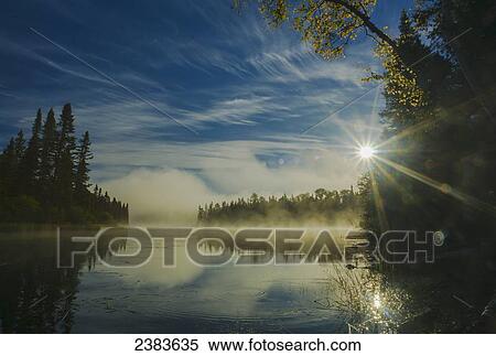 Mist rising off Lake Kipawa in the morning; Quebec, Canada View Large Photo Image Stock Photography - Mist rising off Lake Kipawa in the morning; Quebec, Canada. Fotosearch
