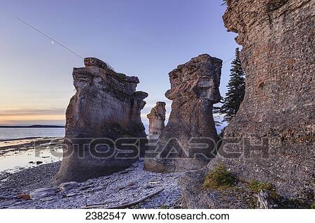 Monolith at dawn, Anse des Bonnes Femmes at Ile Niapiskau, Mingan Archipelago National Park Reserve of Canada, Cote-Nord, Duplessis region; Quebec, Canada View Large Photo Image Stock Photo - Monolith at dawn, Anse des Bonnes Femmes at Ile Niapiskau, Mingan Archipelago National Park Reserve of Canada, Cote-Nord, Duplessis region; Quebec, Canada. Fotosearch