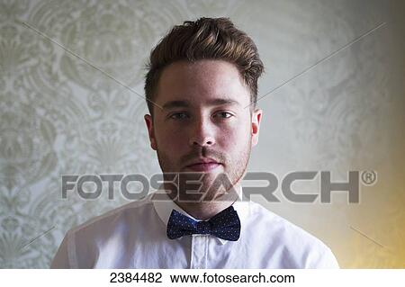 Portrait of a man wearing a bow tie; British Columbia, Canada View Large Photo Image Stock Image - Portrait of a man wearing a bow tie; British Columbia, Canada. Fotosearch