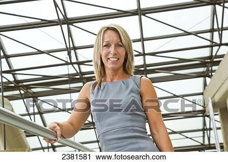 Portrait Of A Mature Professional Businesswoman In Downtown Office Environment; Edmonton, Alberta, Canada View Large Photo Image Stock Image - Portrait Of A Mature Professional Businesswoman In Downtown Office Environment; Edmonton, Alberta, Canada. Fotosearch
