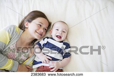 Portrait of a sister with her baby brother; Victoria, British Columbia, Canada View Large Photo Image Stock Image - Portrait of a sister with her baby brother; Victoria, British Columbia, Canada. Fotosearch