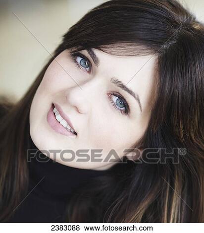Portrait of a woman with brunette hair and blue eyes; Montreal, Quebec, Canada View Large Photo Image Stock Photo - Portrait of a woman with brunette hair and blue eyes; Montreal, Quebec, Canada. Fotosearch