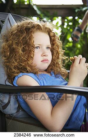 Portrait of a young girl with red curly hair; Guelph, Ontario, Canada View Large Photo Image Stock Photograph - Portrait of a young girl with red curly hair; Guelph, Ontario, Canada. Fotosearch