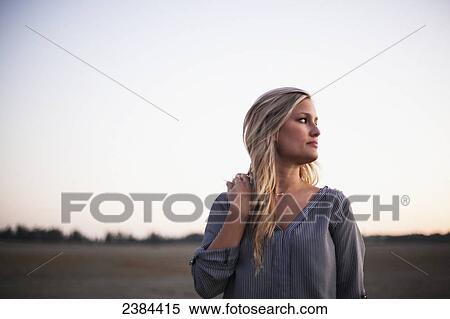 Portrait of a young woman with long blond hair; Victoria, British Columbia, Canada View Large Photo Image Stock Photography - Portrait of a young woman with long blond hair; Victoria, British Columbia, Canada. Fotosearch
