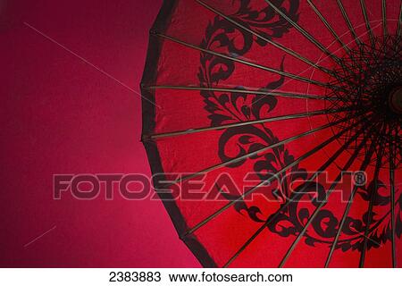 Stock Image - Red Burmese umbrella; Yangon, Myanmar. Fotosearch