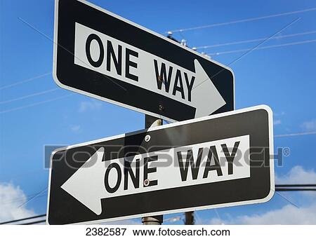 Stock Photo - Road signs with arrows saying one way; Honolulu, Oahu, Hawaii, United States of America. Fotosearch