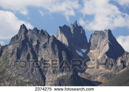 Rugged mountain peaks; Yukon, Canada View Large Photo Image Stock Photography - Rugged mountain peaks; Yukon, Canada. Fotosearch