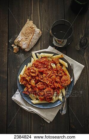 Picture - Sausage penne meal with bread. Fotosearch