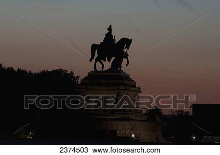 Silhouette of an equestrian statue at dusk; Koblenze, Germany View Large Photo Image Stock Image - Silhouette of an equestrian statue at dusk; Koblenze, Germany. Fotosearch