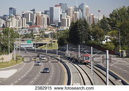 Skyline of downtown Calgary with roadway and light rail train; Beiseker, Alberta, Canada View Large Photo Image Stock Photography - Skyline of downtown Calgary with roadway and light rail train; Beiseker, Alberta, Canada. Fotosearch